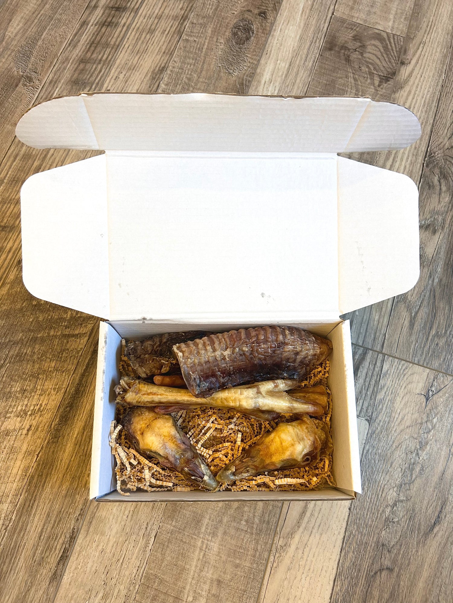 White box filled with dehydrated dog chews