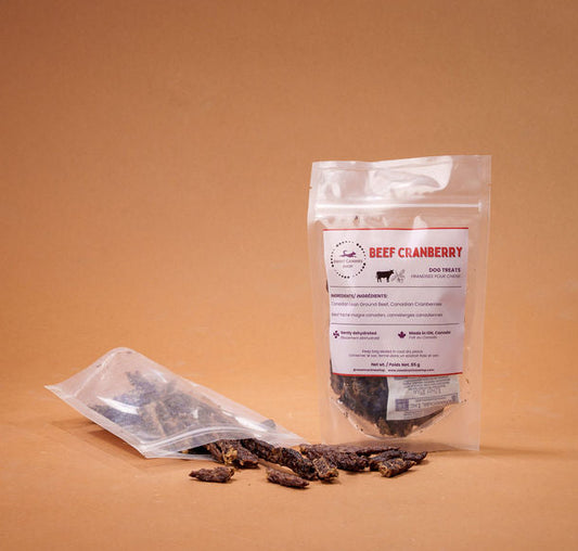 Dried cranberries with a transparent packaging bag on a brown background